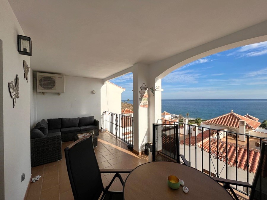 Two apartments located below each other with beautiful sea views, communal pool and garage space in El Peñoncillo, Torrox